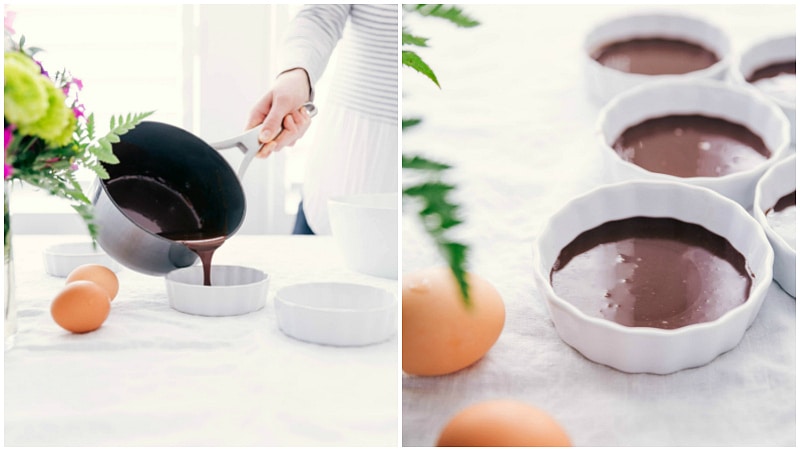 Tuxedo Crème Brûlée is a chocolatey twist on the traditional crème brûlée recipe. This dessert has a chocolate ganache bottom, creamy custard filling, and a caramelized sugar topping. Top these brulée with fresh berries and chocolate curls for a delicious show-stopping dessert. Recipe via ChelseasMessyApron.com #cremebrulee #tuxedo #ganache #French #dessert #elegant Image of the chocolate layer being poured into the ramekins for these Tuxedo Crèmes Brûlée.