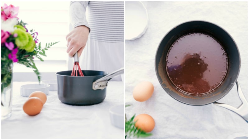 Tuxedo Crème Brûlée is a chocolatey twist on the traditional crème brûlée recipe. This dessert has a chocolate ganache bottom, creamy custard filling, and a caramelized sugar topping. Top these brulée with fresh berries and chocolate curls for a delicious show-stopping dessert. Recipe via ChelseasMessyApron.com #cremebrulee #tuxedo #ganache #French #dessert #elegant Image of the base chocolate layer of these Tuxedo Creme Brûlées being made.