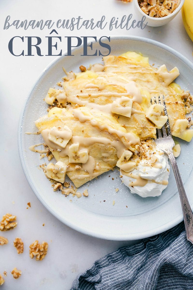 A simple crepe recipe filled with an easy custard filling, plenty of bananas, and chopped walnuts. These banana crepes are easy to make -- the actual crepes and custard can be made ahead of time so when you're ready to serve, these come together in a flash. via chelseasmessyapron.com #banana #crepe #breakfast #easy #quick #crepes #french #dessert #custard #walnut #whipped #cream #caramel #syrup