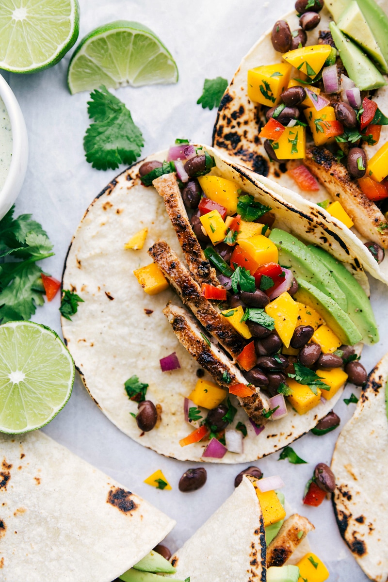 Up close photo of a jamaican jerk taco with jerk rubbed chicken and mango black bean salsa