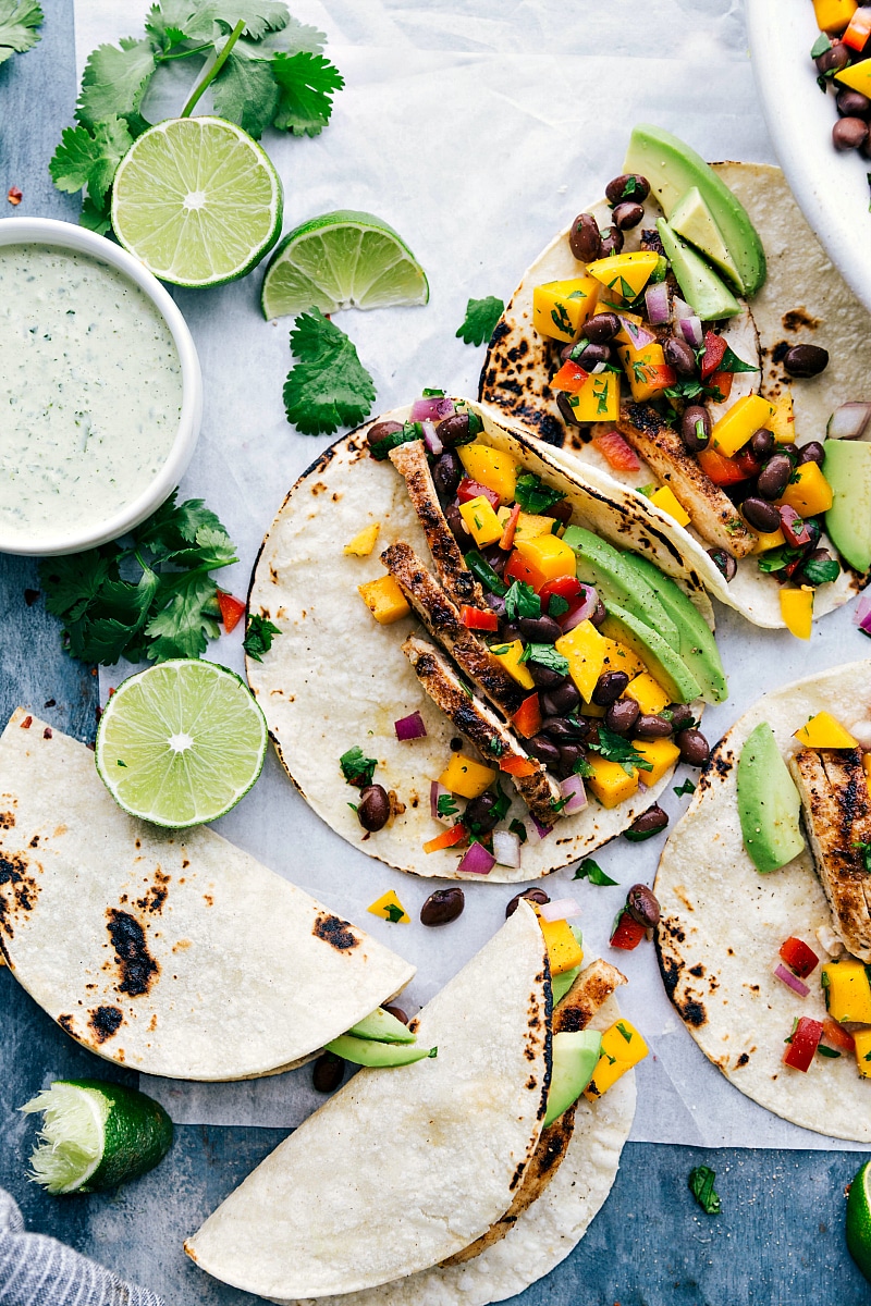 Overhead photo of jamaican jerk tacos with jerk rubbed chicken and mango black bean salsa