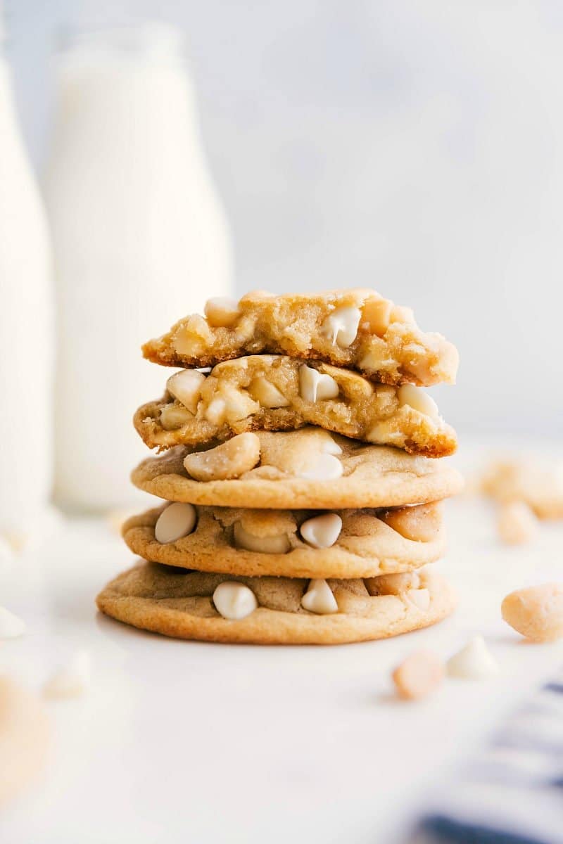 White Chocolate Macadamia Nut Cookies stacked with one broken in half.