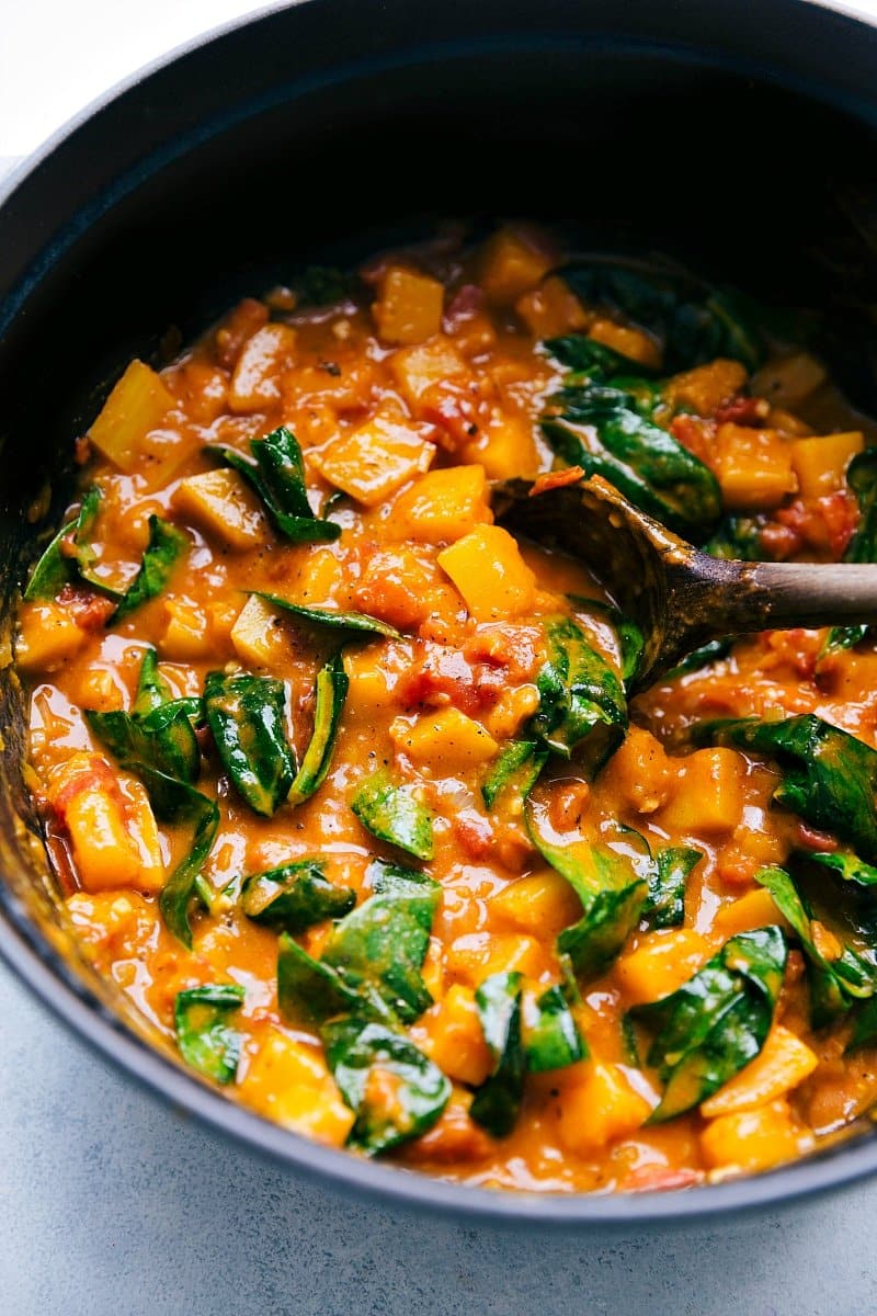 Image of Butternut Squash Curry in the pot with the spinach added.