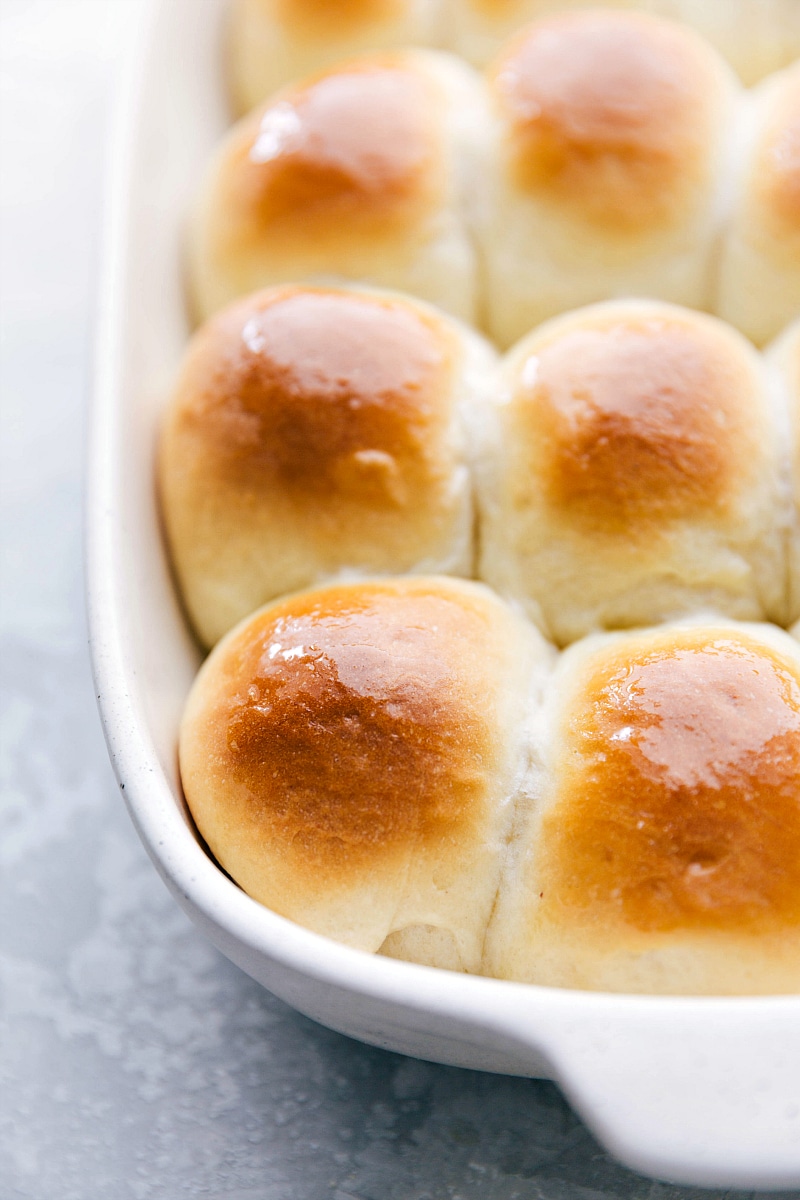 Image of the fresh-baked Dinner Rolls with melted butter brushed over the tops.