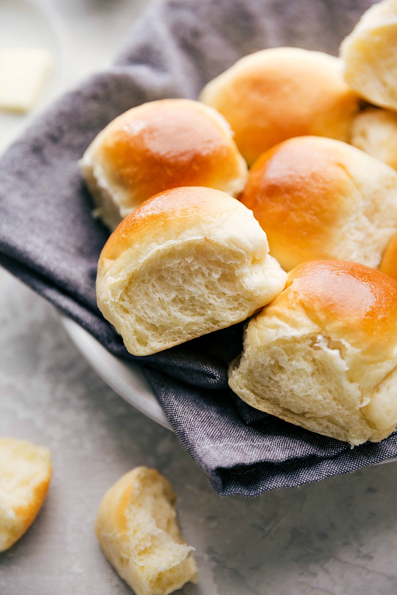 Photo of a bowl filled with warm Dinner Rolls.