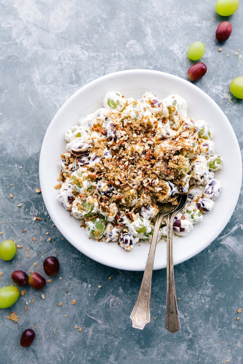 Overhead image of ready-to-eat Grape Salad with brown sugar and pecans on the top.