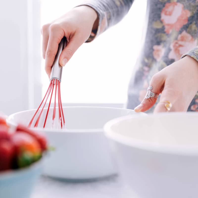 Wet ingredients being whisked together for the best Waffle Recipe.