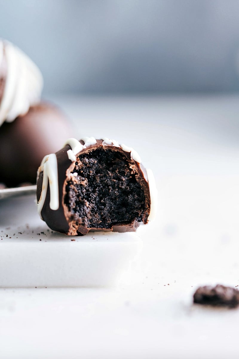 Finished truffle with a bite taken out, revealing the fluffy and moist interior.