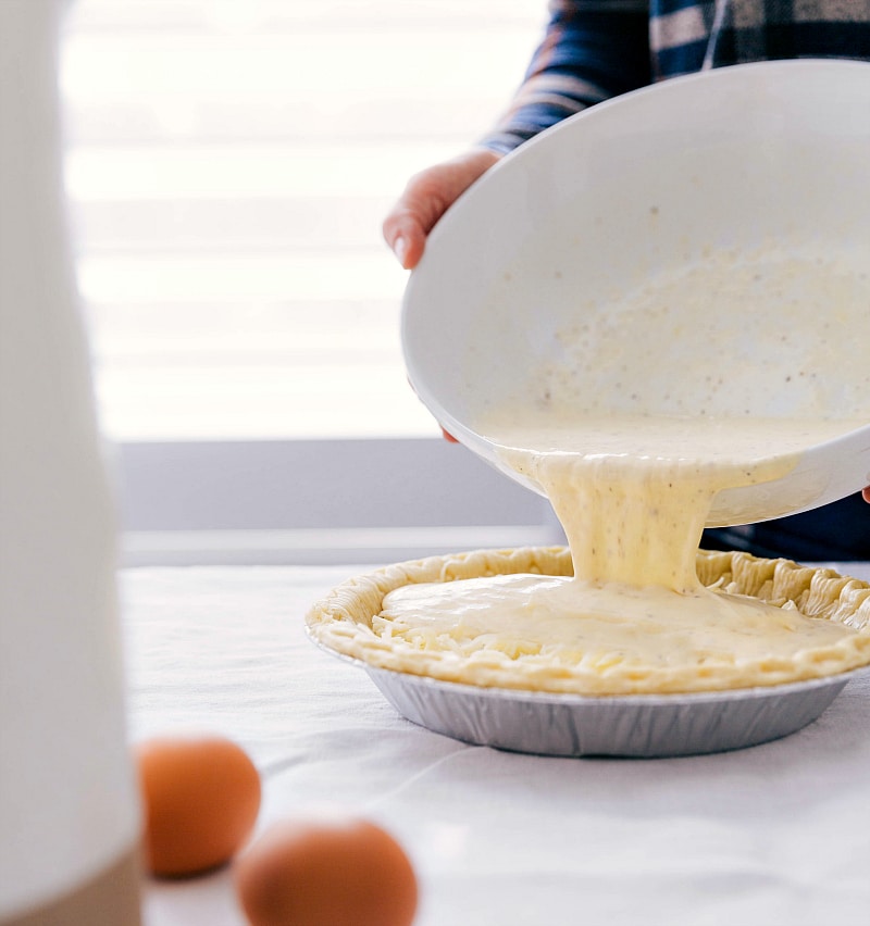 Pouring the cream and egg mixture into the crust.