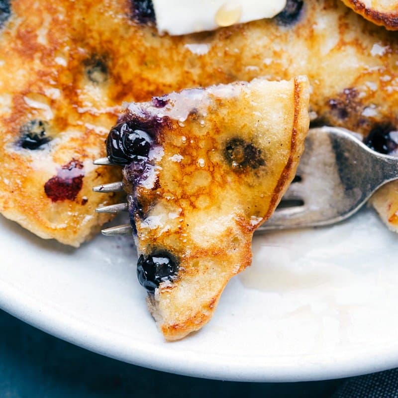 Up close image of a bite of the breakfast on a fork ready to eat
