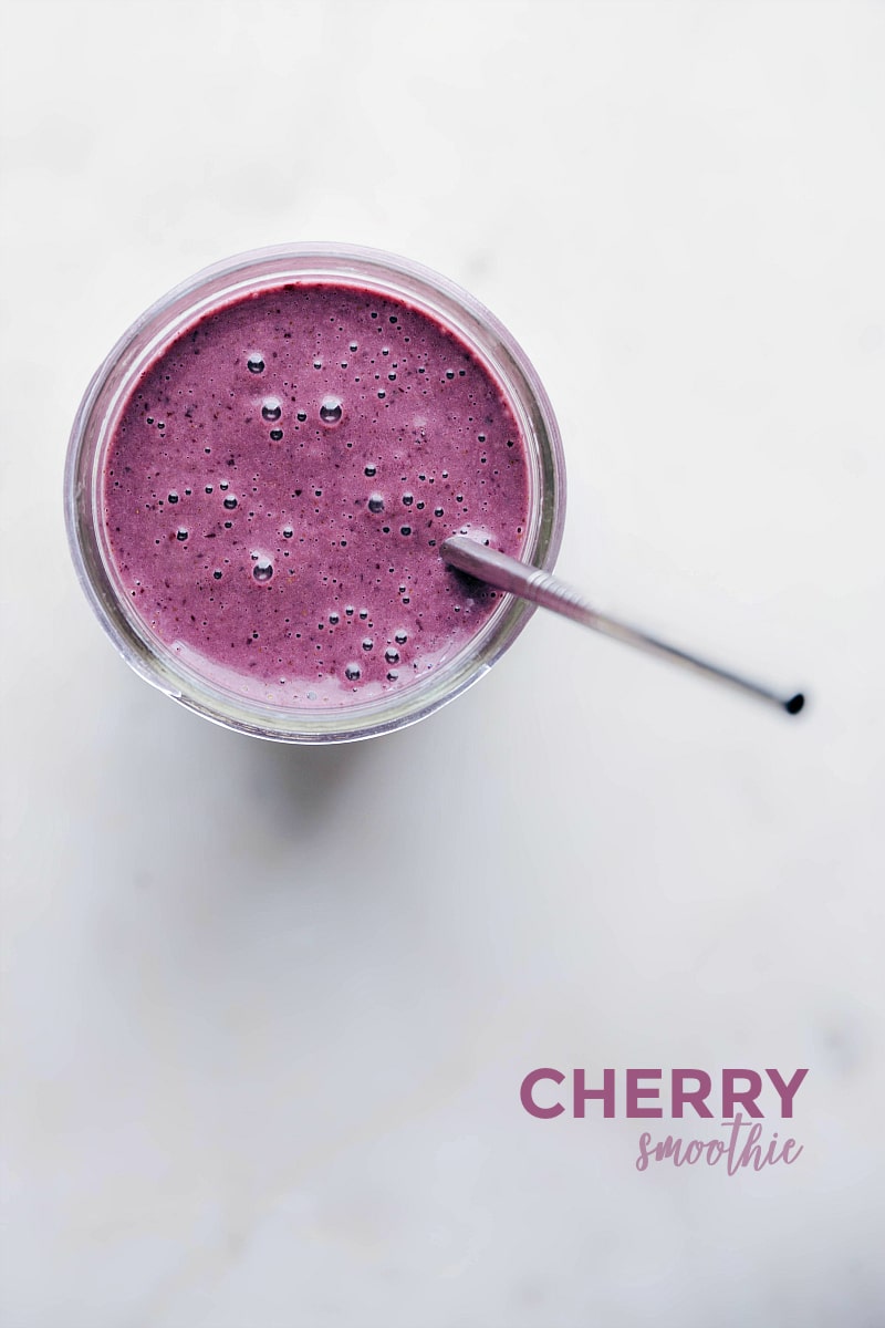 Overhead image of a Cherry Smoothie with a straw in it.