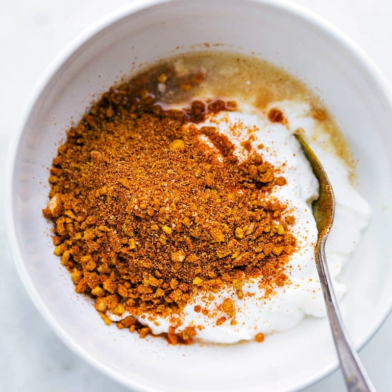 Marinade ingredients being added to a bowl.