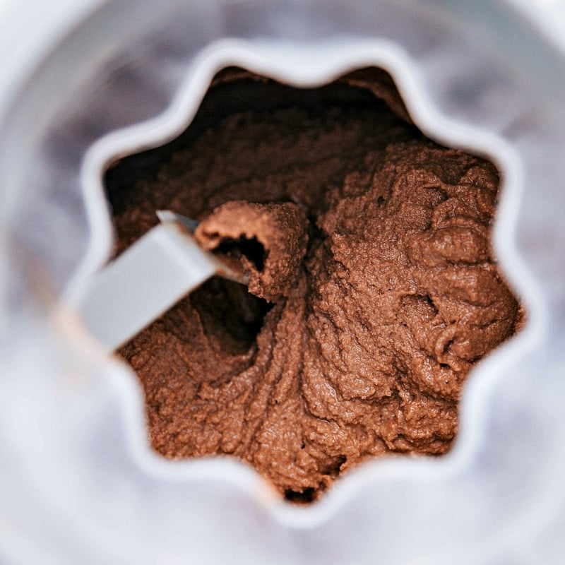 Chocolate gelato churning in the ice cream maker, achieving the perfect creamy texture.
