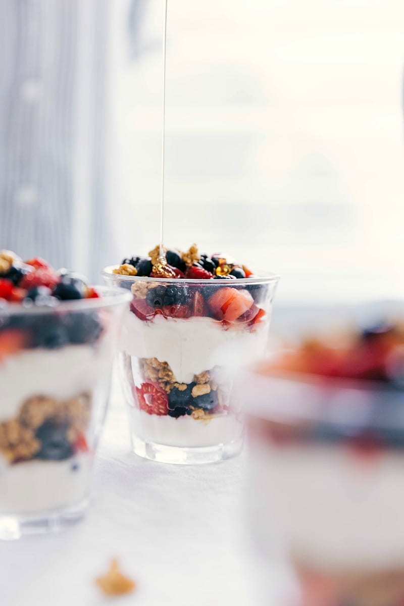 Image of honey being drizzled onto the top of a Parfait.