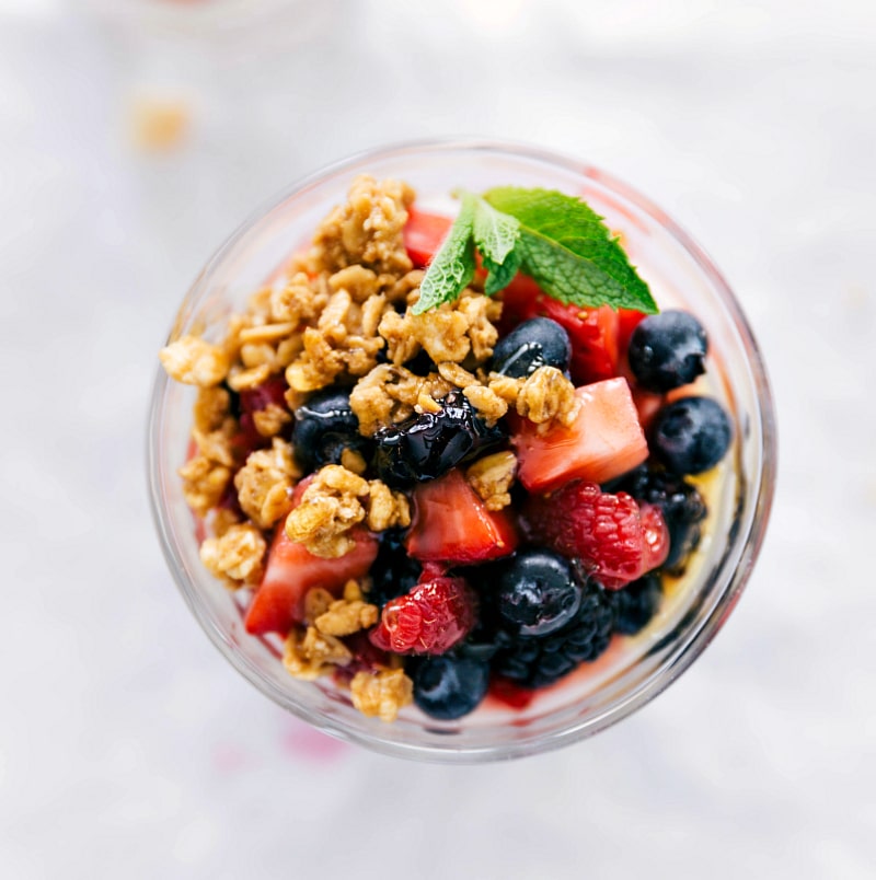 Overhead shot of finished Parfait with berries and honey.