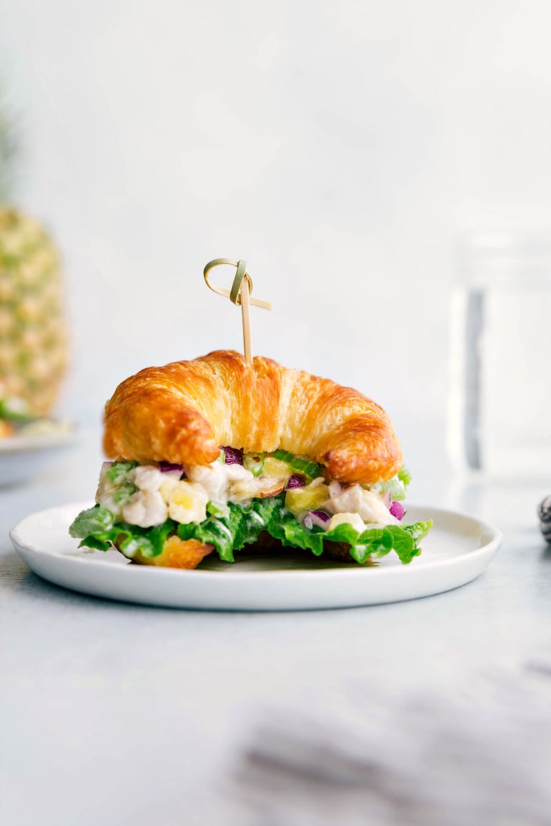 Close-up picture of Pineapple Chicken Salad on a croissant.