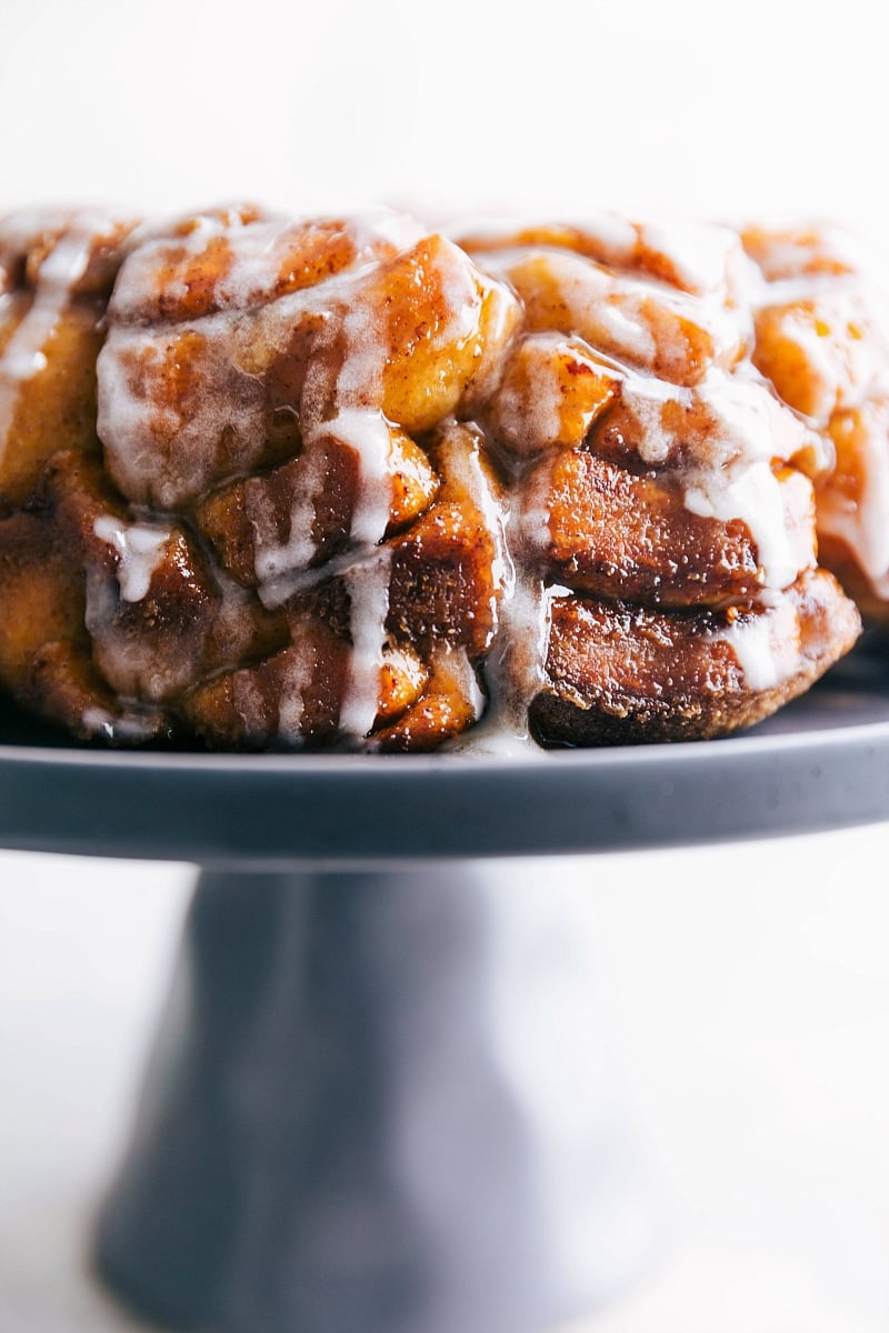 The finished cinnamon roll monkey bread recipe with the cream cheese frosting, showcasing the texture and flavor of this delightful dessert.