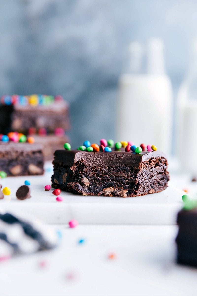 Cosmic brownie with a bite taken out of it, showcasing its delicious, fudgy texture - a nostalgic treat.