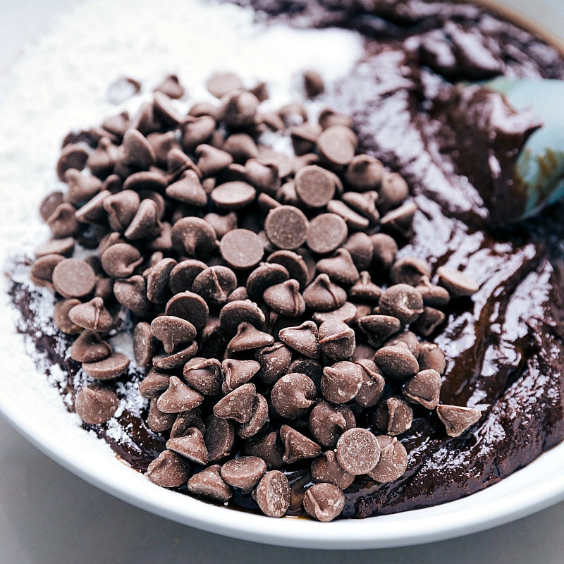 Image of chocolate chips being added to the batter for Cosmic Brownies.