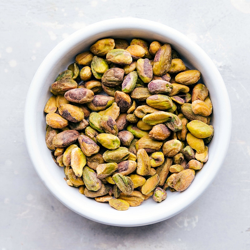 Overhead image of a bowl of fresh pistachios.