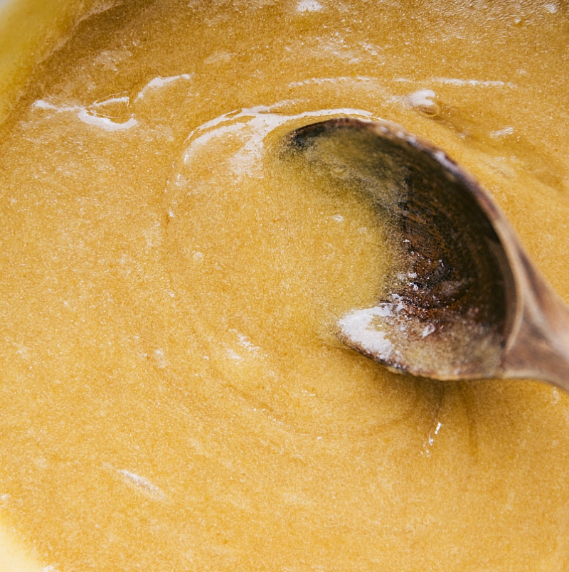 Overhead image of the wet ingredients being mixed together in a bowl.