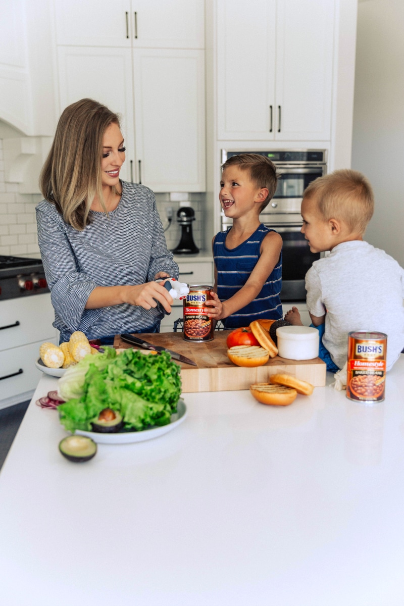 Image of Chelsea and the boys opening a can of baked beans that go on the side of this Chicken Burger.