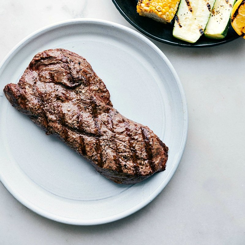 Image of freshly grilled Flat Iron Steak on a plate.