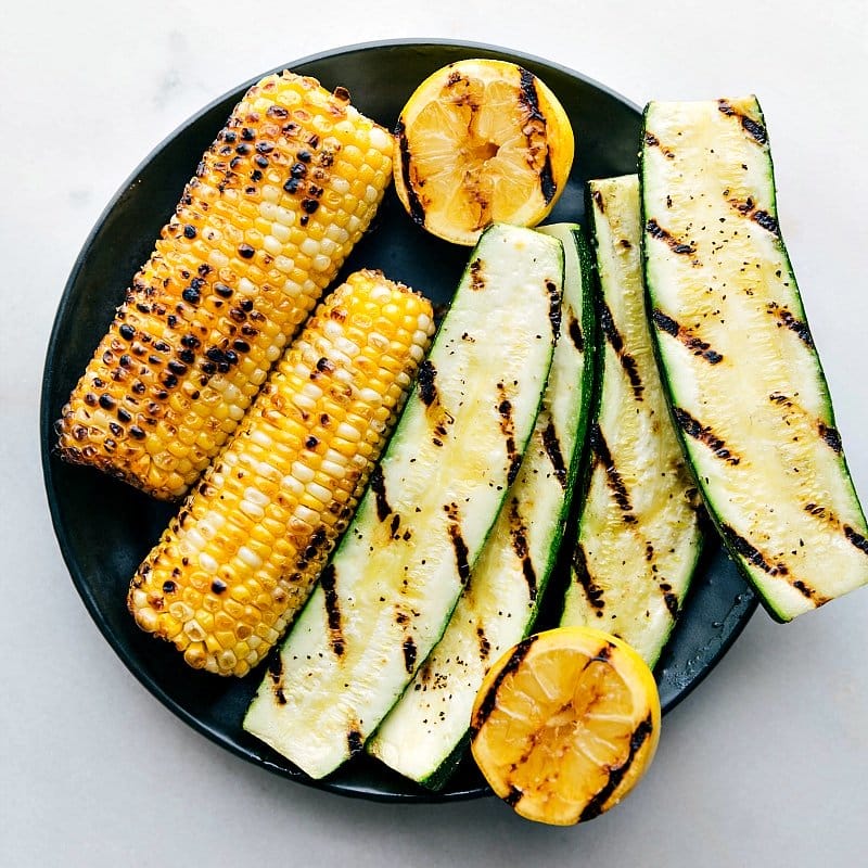 Image of the grilled corn, zucchini, and lemon that go on the side salad with the flat iron steak