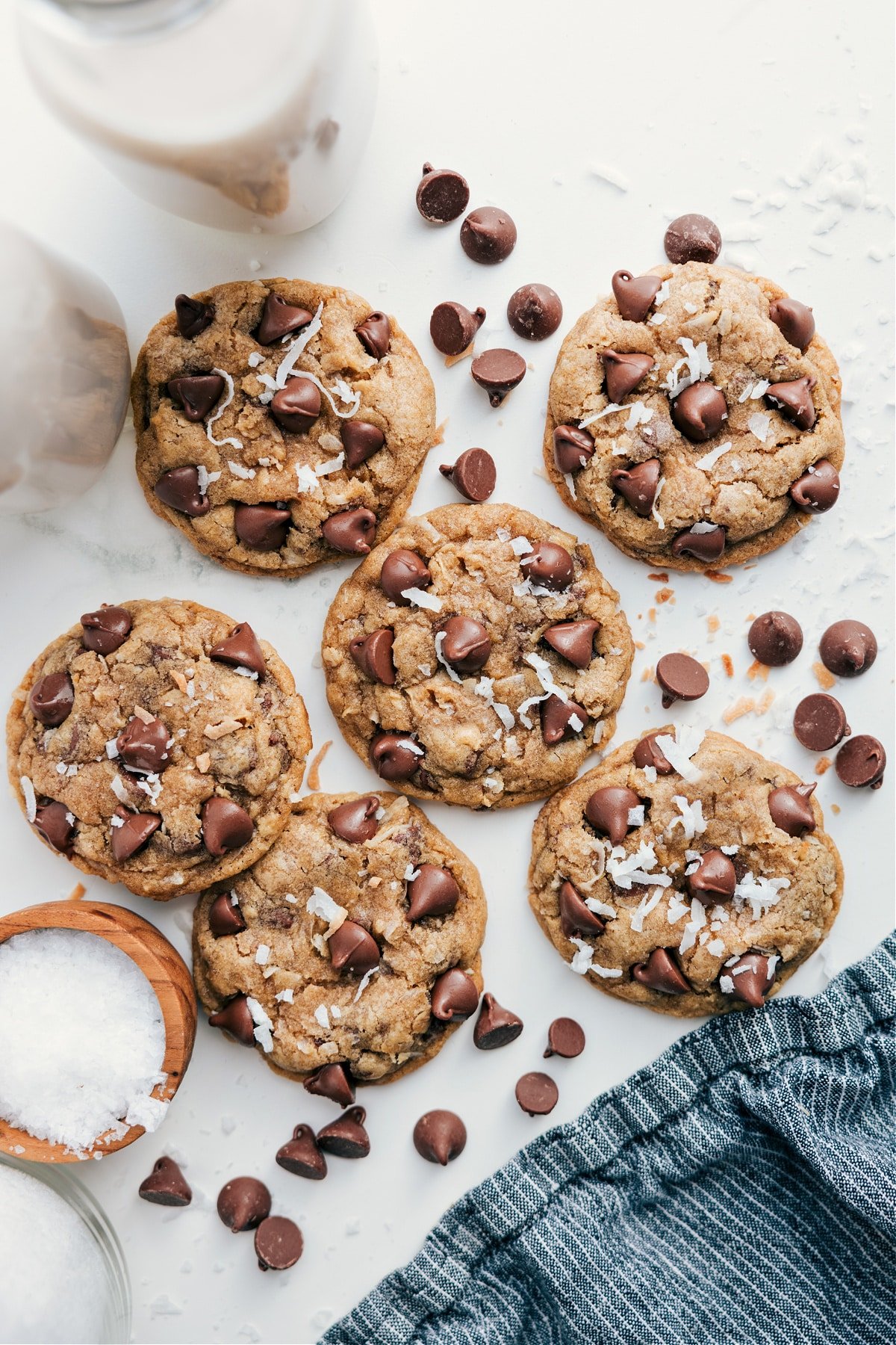 Freshly Baked Coconut-Oatmeal Cookies with Warm Chocolate Chips Oatmeal Coconut Cookies fresh out of the oven with extra coconut sprinkled on top.