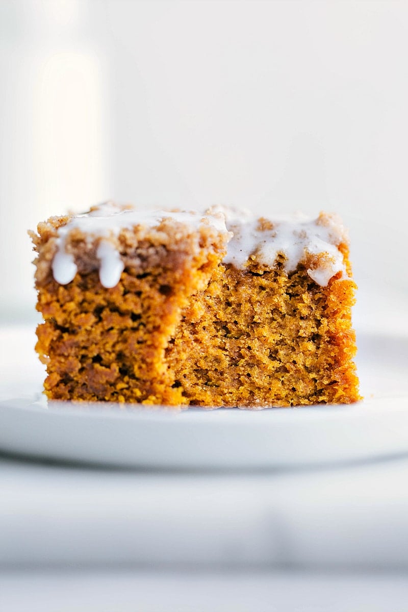 Slice of the finished pumpkin coffee cake recipe topped with sweet icing.