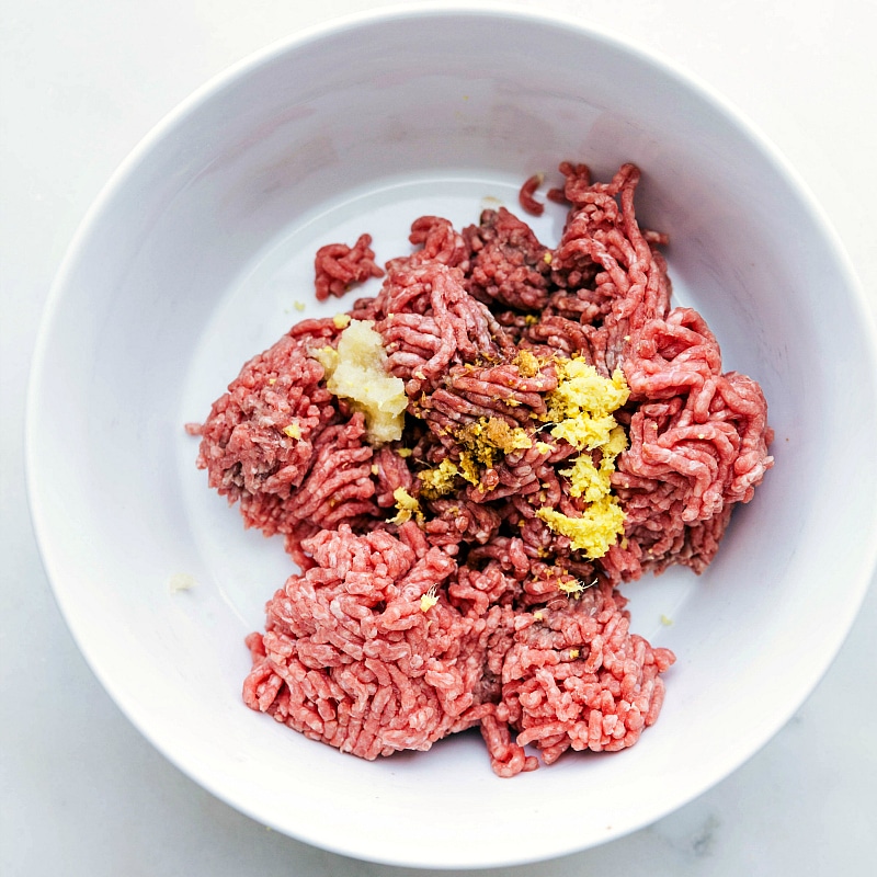 Process shot-- Image of the ground beef and seasonings being mixed together for the base meat patty.