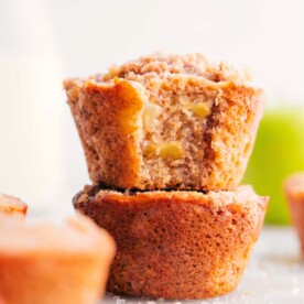 Freshly baked apple muffins, warm and delicious, with chunks of fresh apples and the complimentary taste of cinnamon.