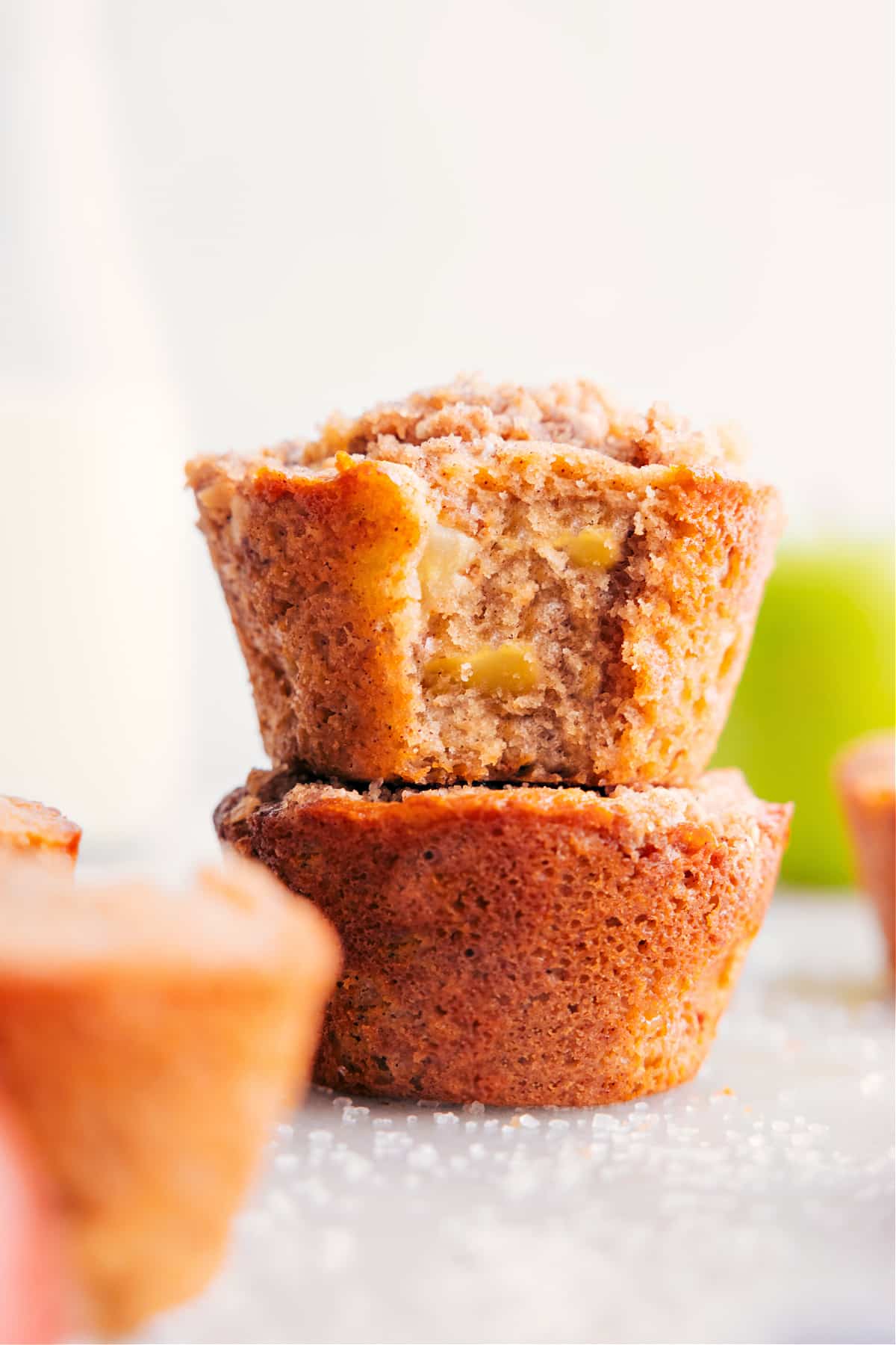 Freshly baked apple muffins, warm and delicious, with chunks of fresh apples and the complimentary taste of cinnamon.