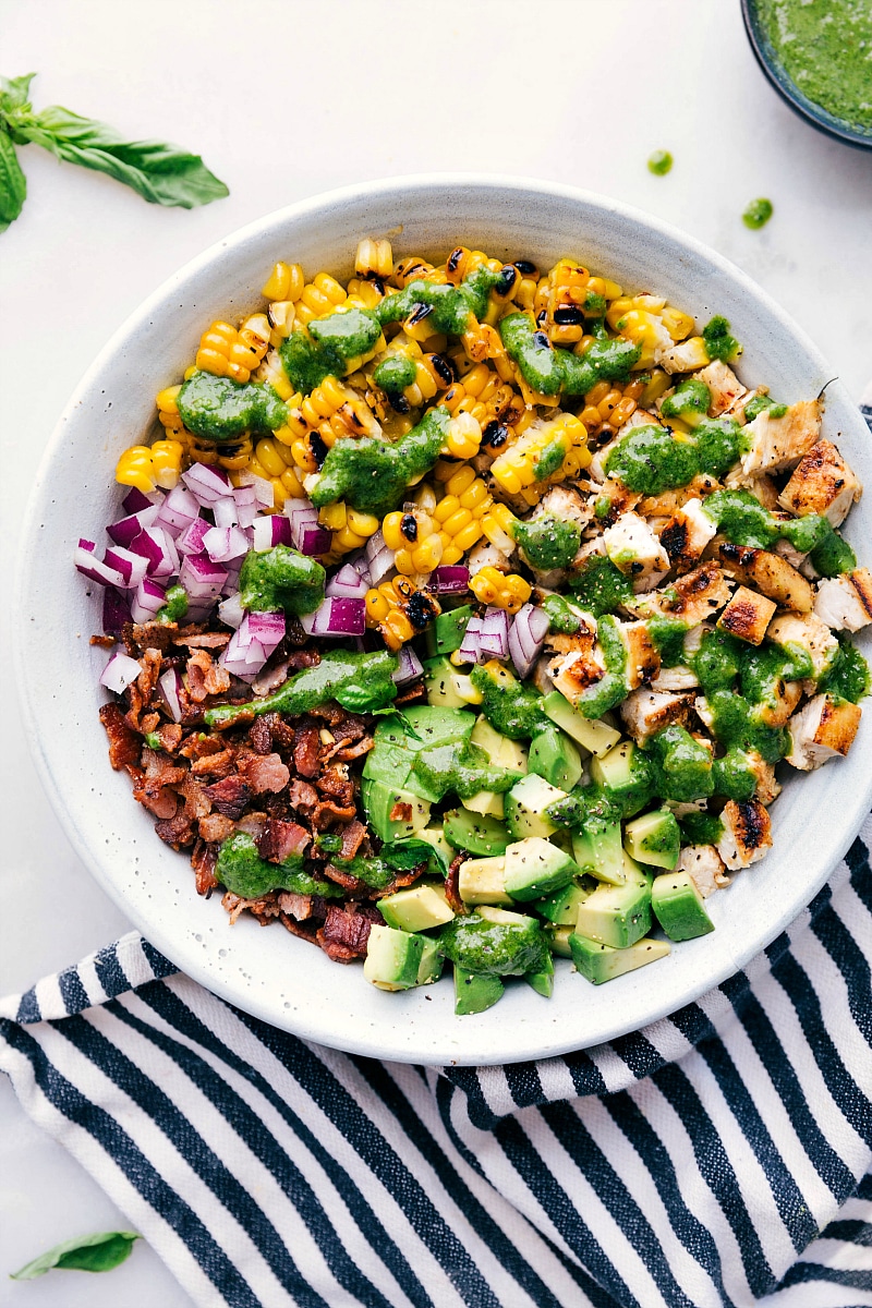 Finished bowl of avocado chicken salad, showcasing a mix of healthy and delicious ingredients.