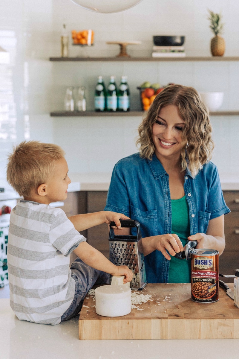 Image of Chelsea and her son opening a can of beans for Baked Alfredo Chicken.