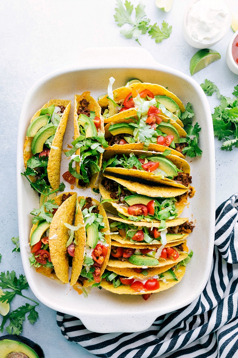 Overhead image of Beef Tacos fresh out of the oven with all the toppings.