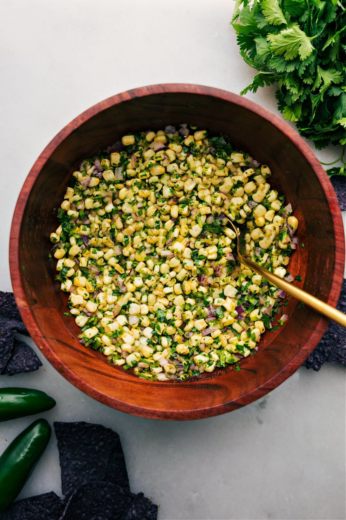 Chipotle Corn Salsa in a large bowl with spoon Chipotle Corn Salsa in a large bowl with spoon