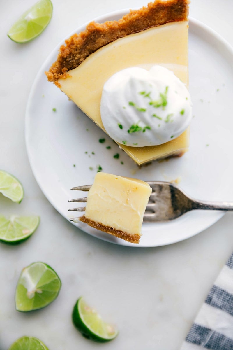 A delicious sweet and tangy slice of dessert with a bite taken out of it.