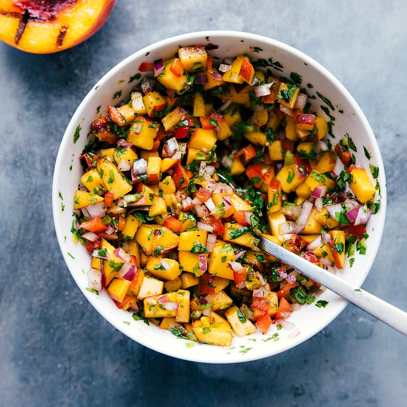 Overhead image of the peach salsa all mixed together in a bowl.