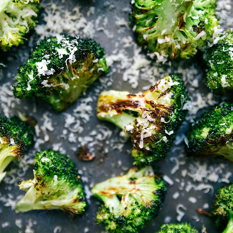 Up-close image of the broccoli, fresh out of the oven with Parmesan cheese on top.