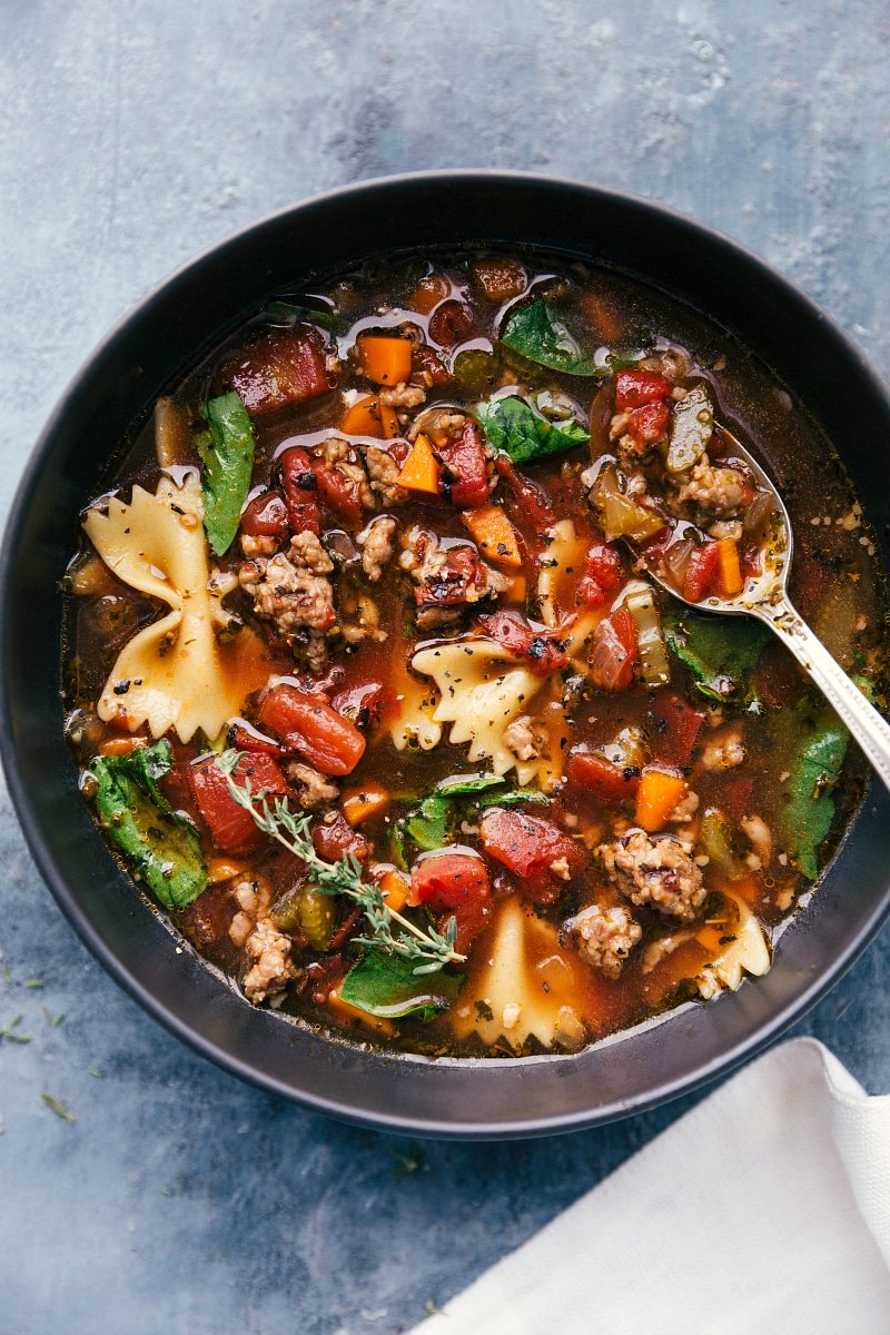 Pasta soup in a bowl, warm and veggie packed ready to be eaten.