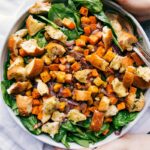 Roasted veggie salad in a giant bowl, delicious and filling, ready to be served.