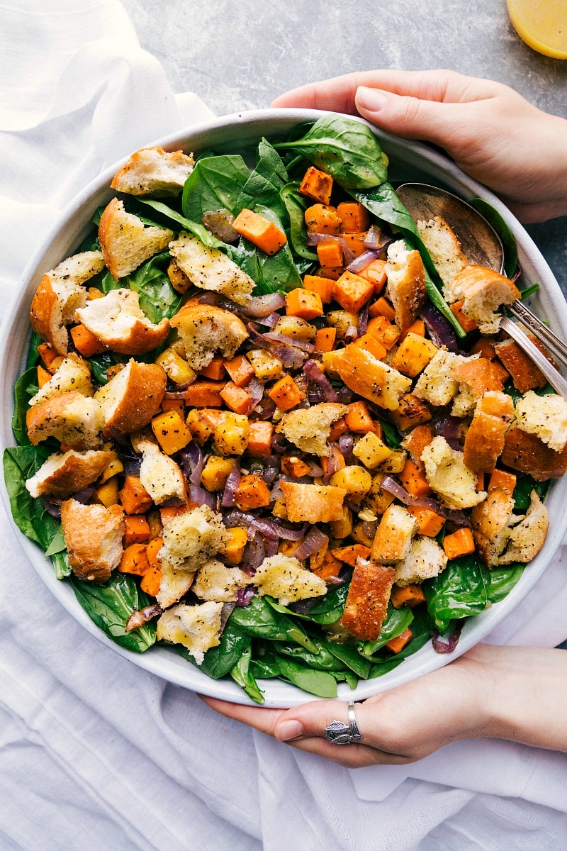 Roasted veggie salad in a giant bowl, delicious and filling, ready to be served.