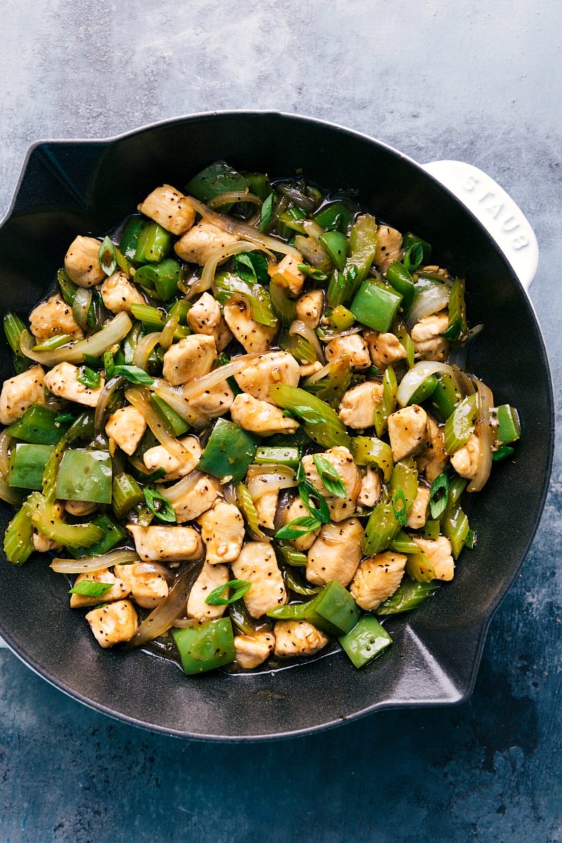 Black pepper chicken in a pan, savory and delicious, ready to be served.