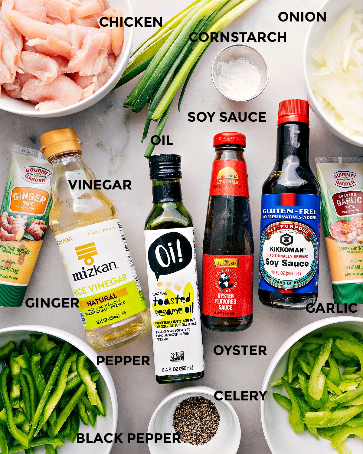 All the ingredients in this recipe prepped out for easy assembly including meat, cornstarch, onion, soy sauce, oil, vinegar, garlic, oyster sauce, rice vinegar, ginger, pepper, celery, and pepper.