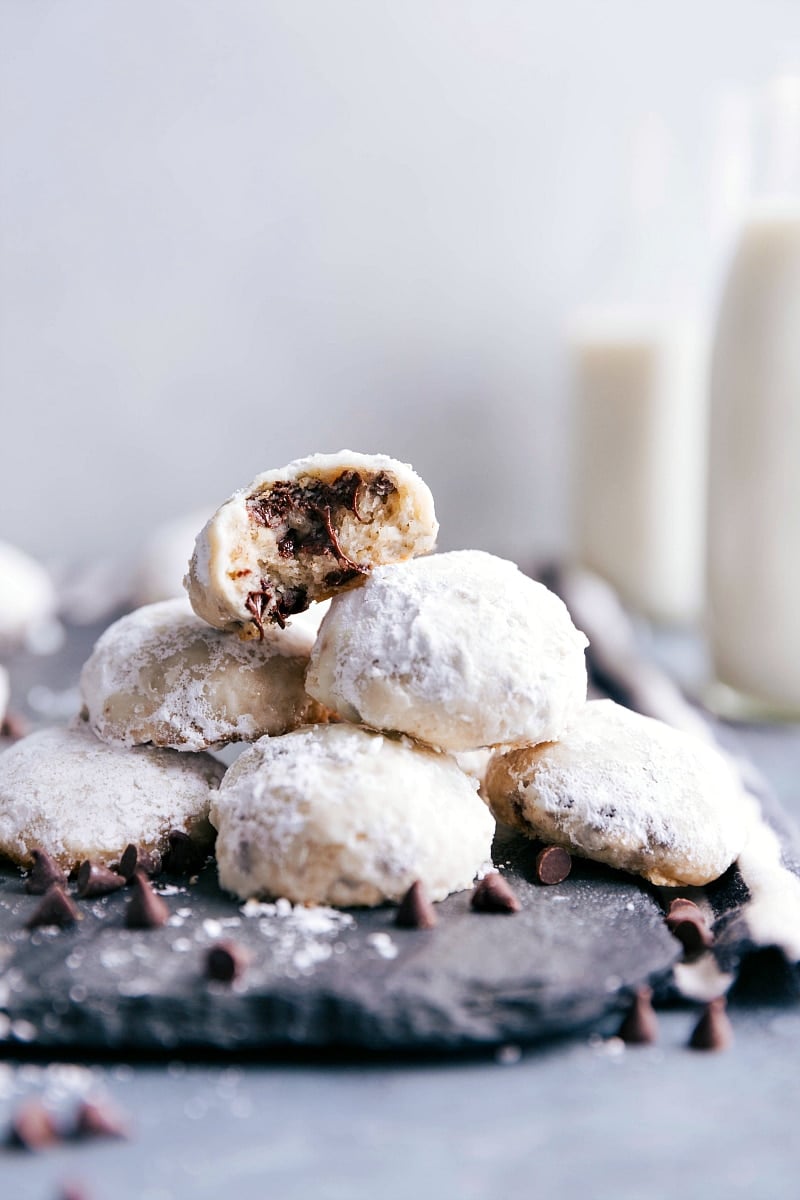 Chocolate Chip Snowball Cookies are buttery, light, and flaky. They're stuffed with miniature chocolate chips and coated in powdered sugar. Recipe via chelseasmessyapron #recipe #chocolatechip #snowball #cookie Chocolate Chip Snowball Cookies