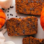 Three slices of chocolate chip pumpkin bread showcasing their delicious interior with scattered chocolate chips.