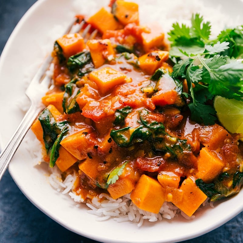 Up-close image of the Sweet Potato Curry in a bowl, over a bed of rice, ready to be eaten.