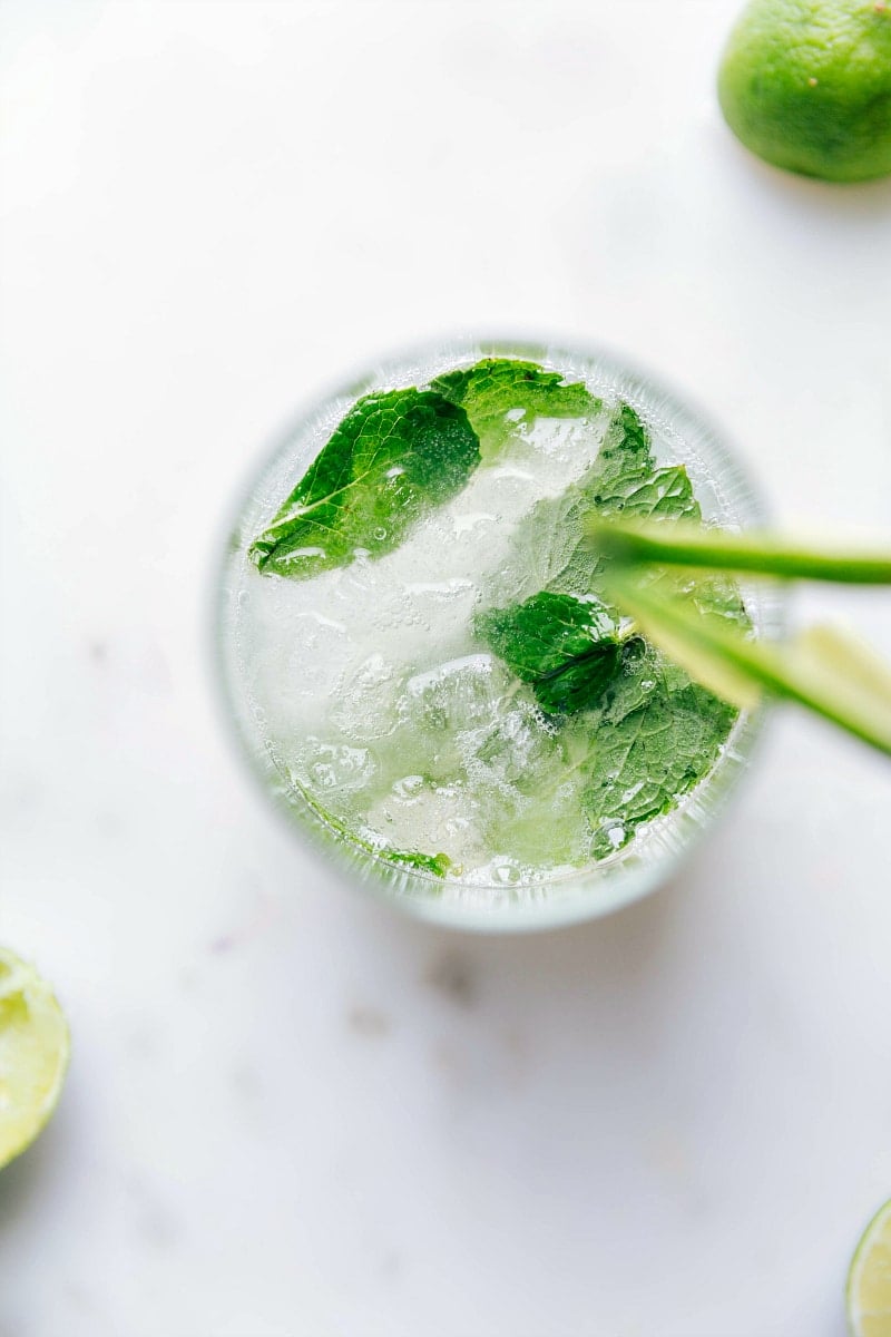 Virgin Mojito with Fresh Mint A refreshing virgin mojito topped with fresh mint leaves, served in a tall glass.