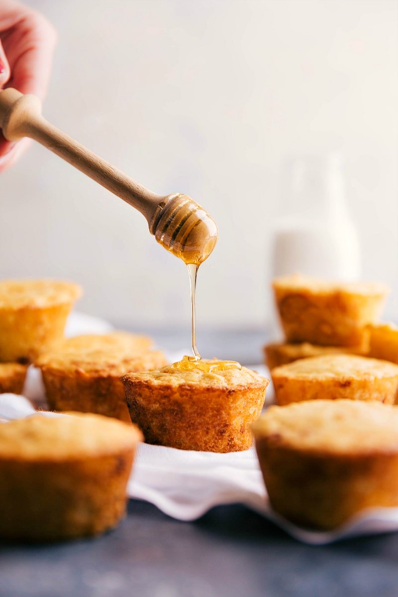 Image of honey being drizzled on Cornbread Muffins.